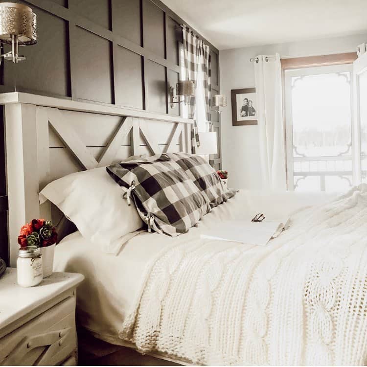 White King Headboard Against Black Paneled Bedroom Wall