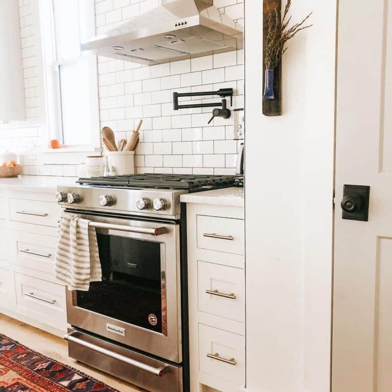 White Kitchen Cabinets with Brass Pulls