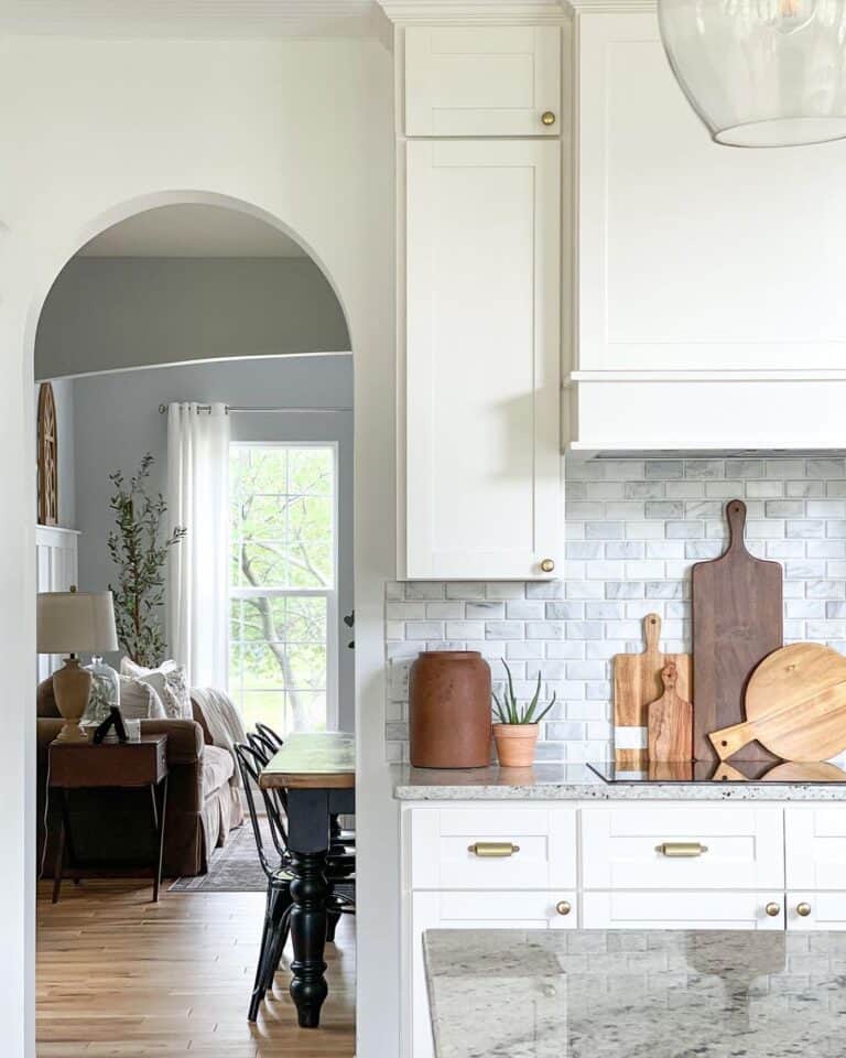 White Kitchen with Gold Hardware and Wood Accents