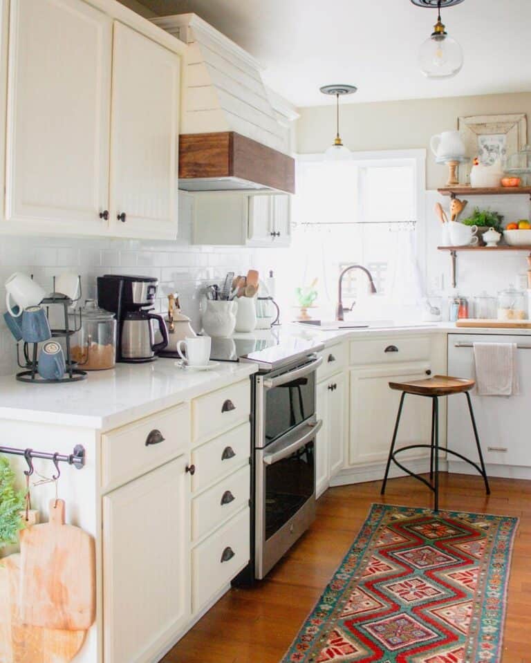White Kitchen with Warm Wood Tones and Brass Cup Pulls