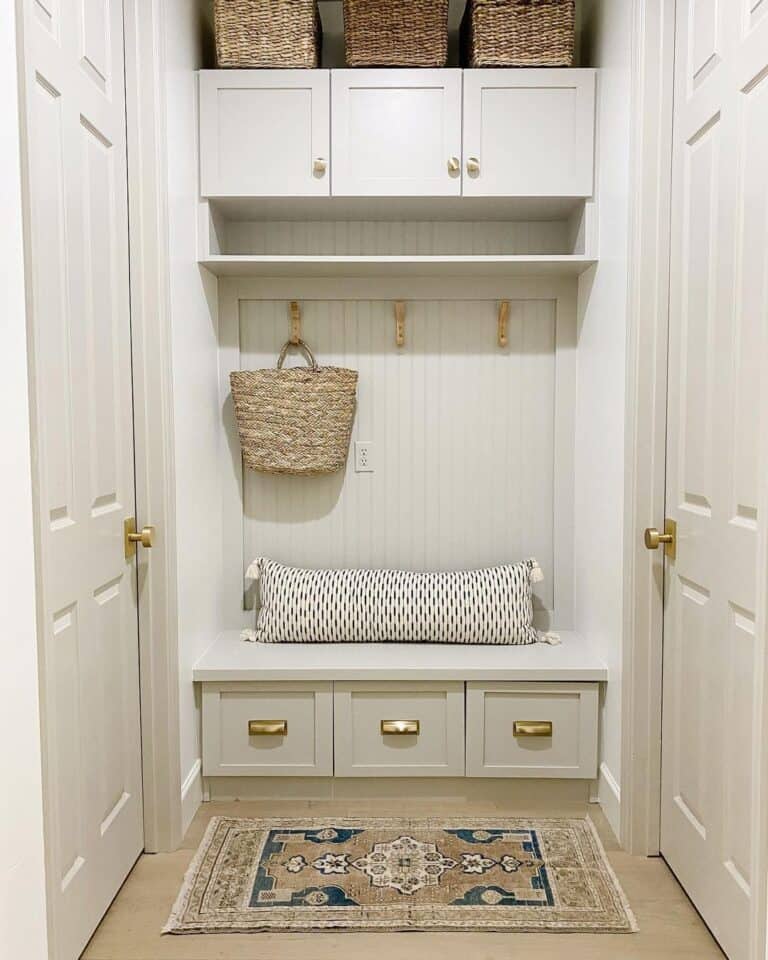 White Mudroom with Polished Brass Cup Drawer Pulls and Knobs