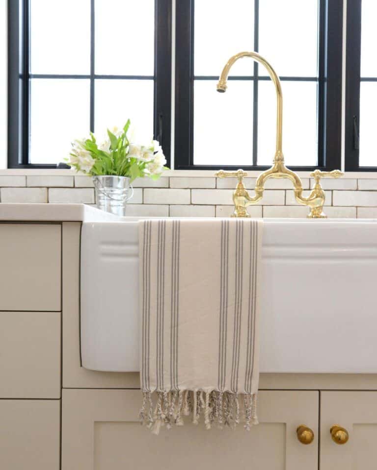White Oversized Apron Sink with Gold Faucet