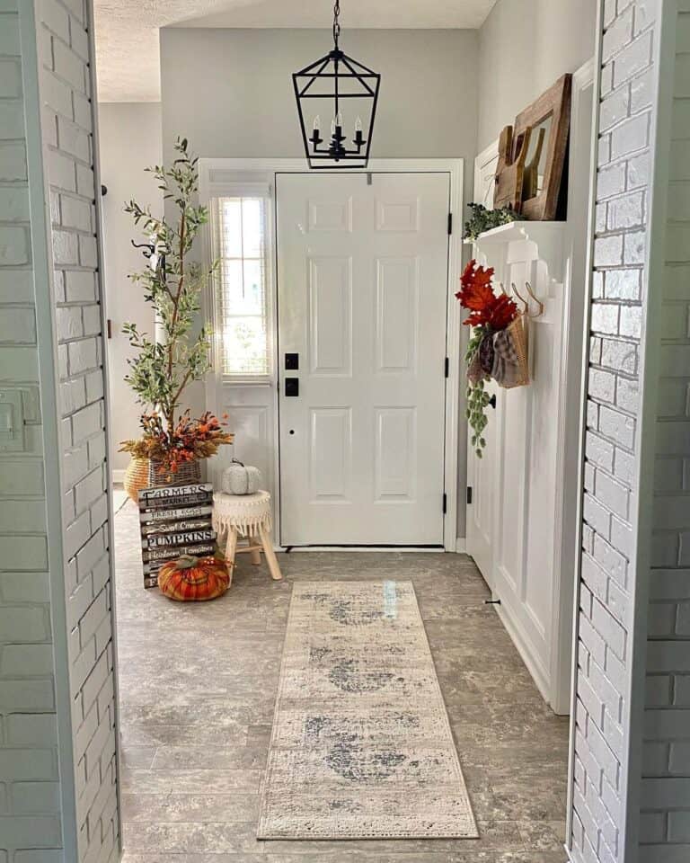 White Pumpkin Next to White 6-Panel Front Door