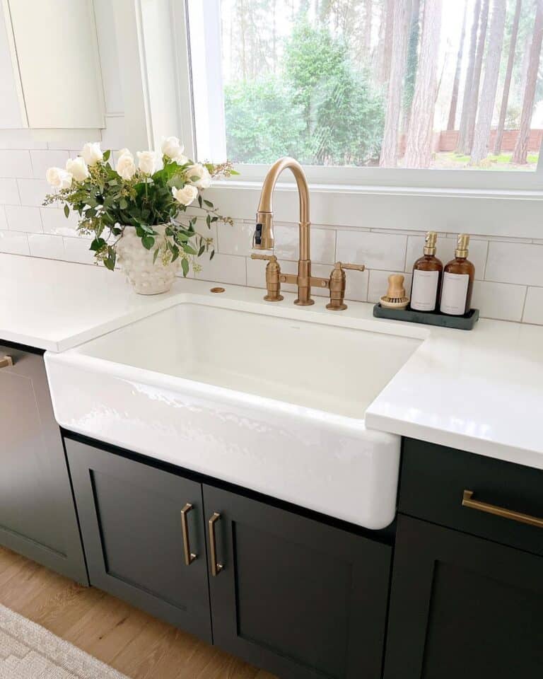 White Roses Next to Brass Faucet with Sprayer