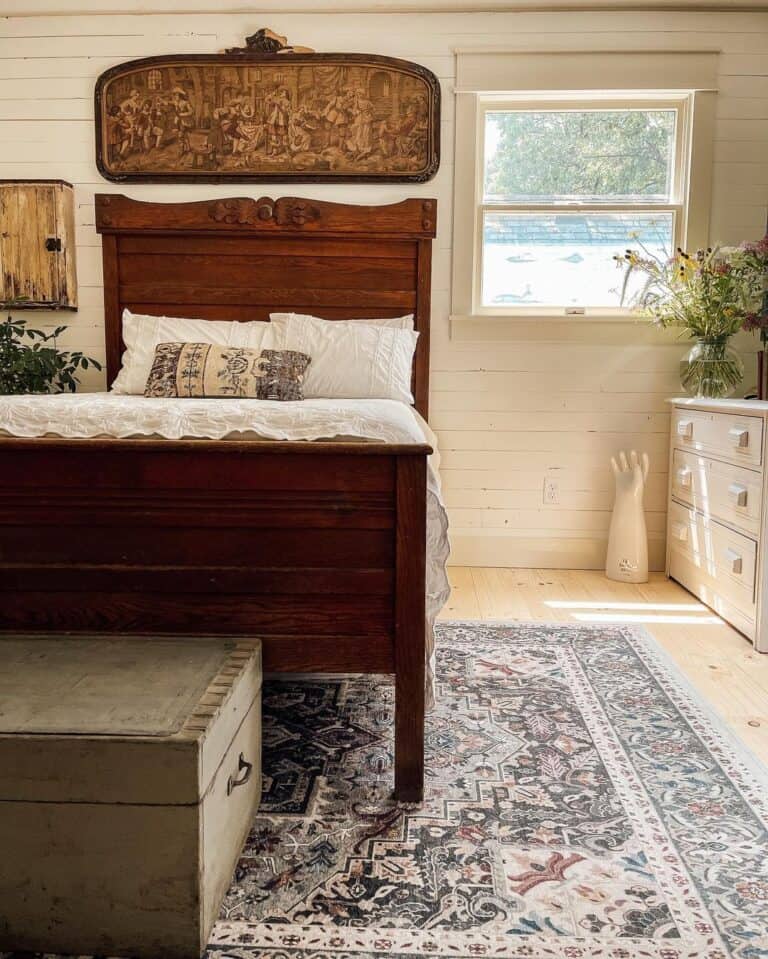 White Shiplap Walls and a Carved Wood Headboard