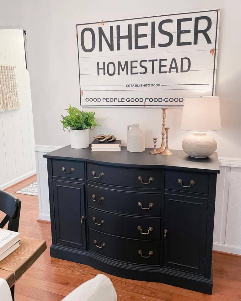 White Sign Over a Black Buffet