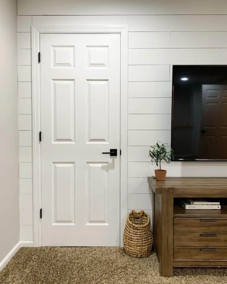 White Six Panel Door on White Shiplap Wall