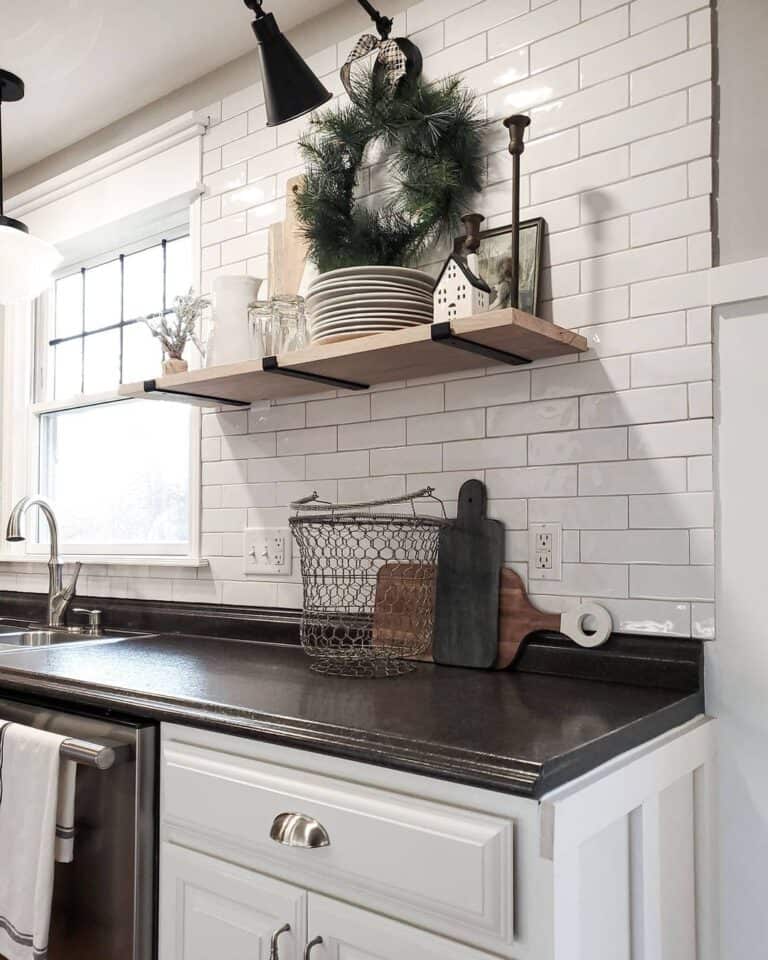 White Subway Backsplash and Black Kitchen Counter