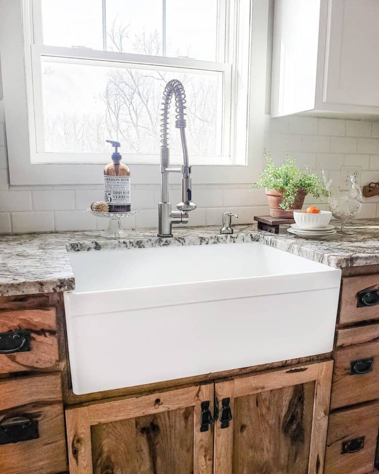 White Subway Tile Backsplash with Granite Countertops and Rustic Cabinet