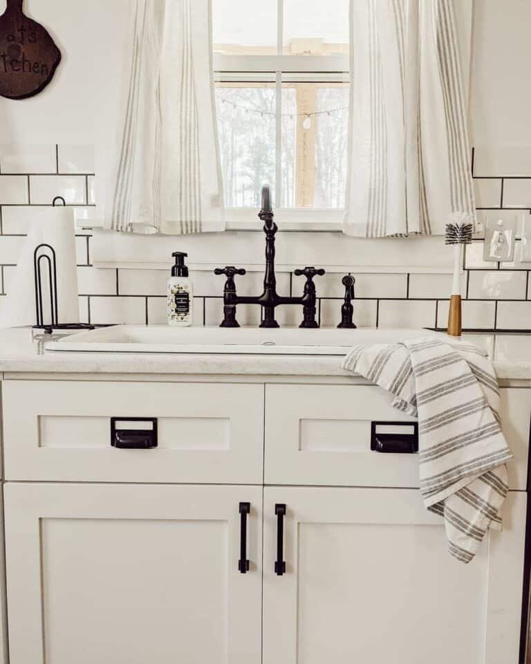 White Subway Tile with Black Grout Backsplash