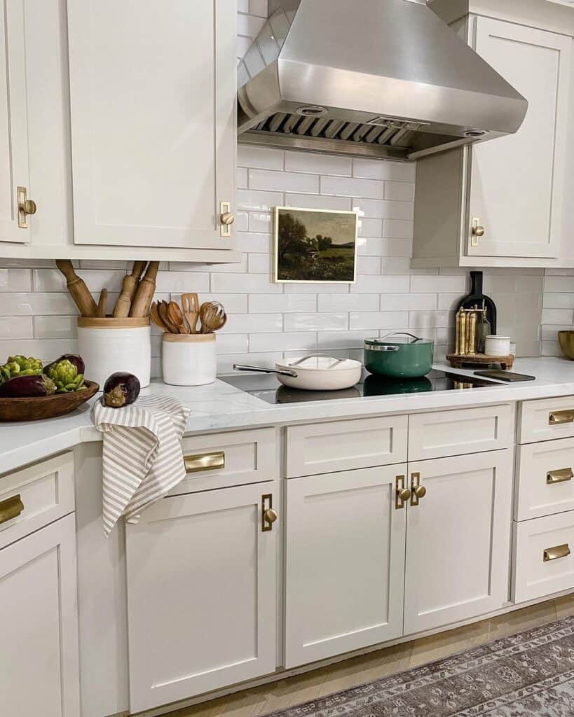 White and Taupe Kitchen with Brass Knobs
