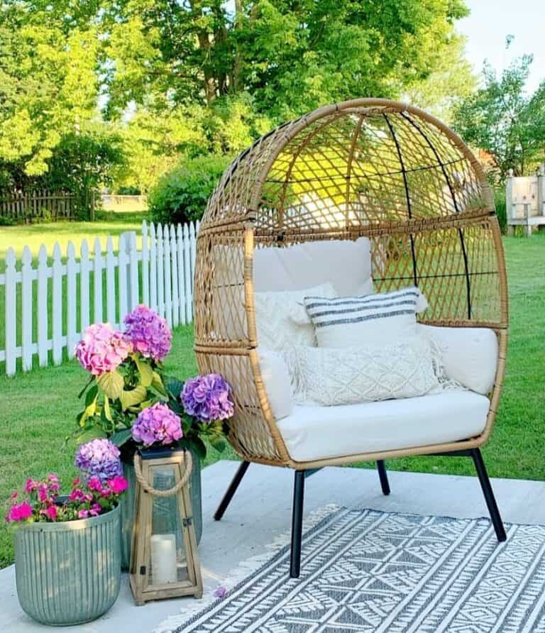 Wicker Chair and Vibrant Flowers in Planters