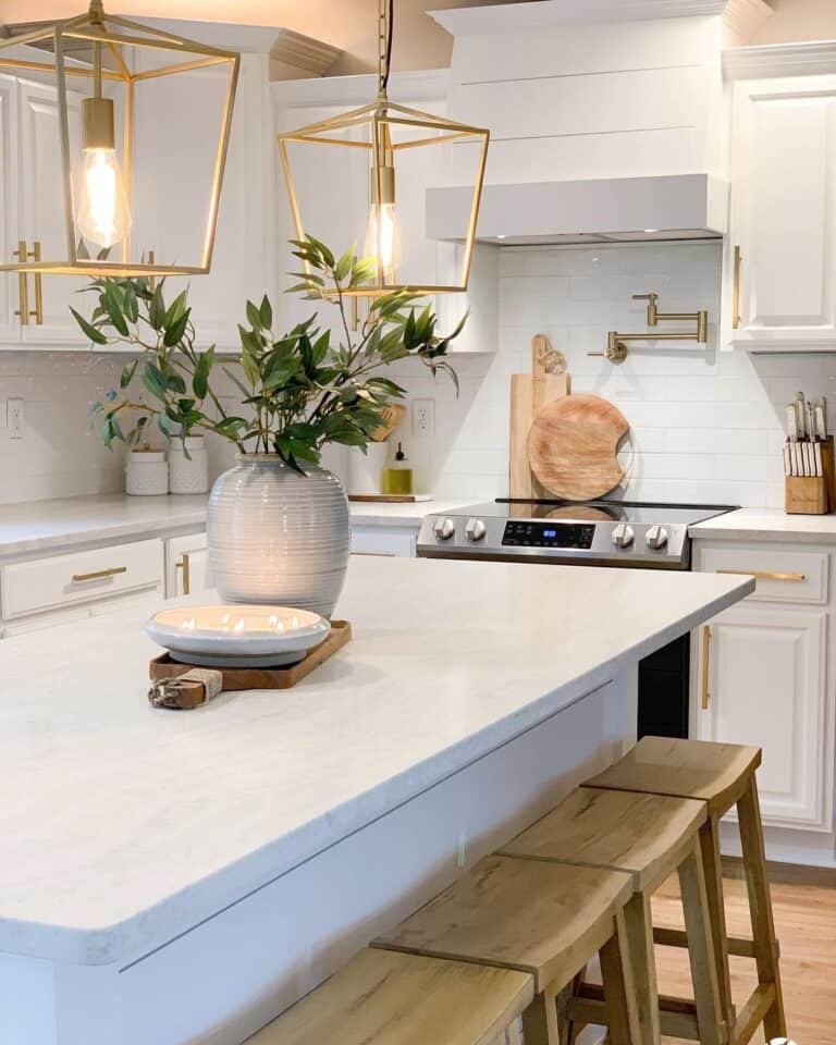 Wood Stools Along White Kitchen Island