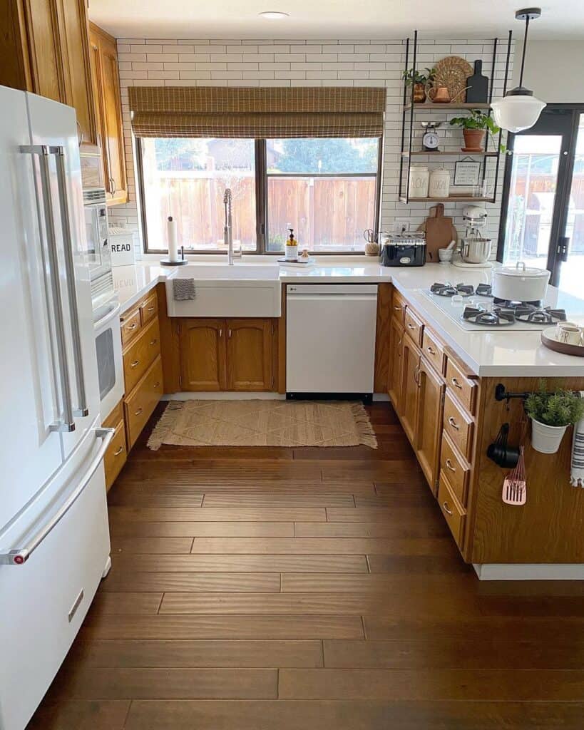 Wooden Cabinets in a U Shaped Kitchen With a Peninsula