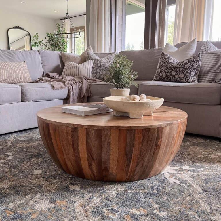 Wooden Drum Coffee Table and Grey Sectional Couch