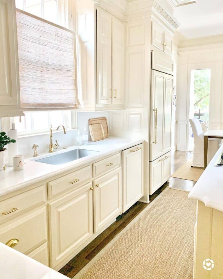 Woven Detailing in White Kitchen with Brass Knobs