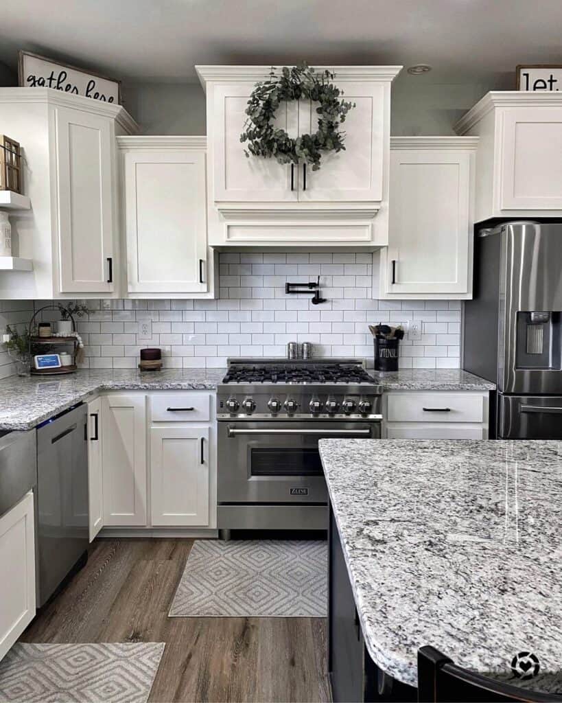 A Wreath on Kitchen Cabinets With Crown Molding on Top