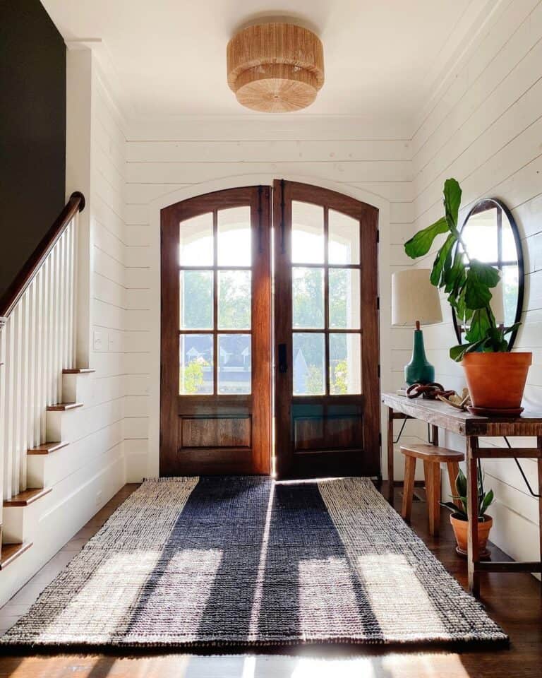 Arched Wood Double Doors with Shiplap Walls