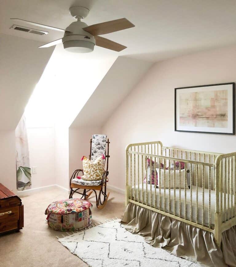 Baby Girl Nursery With Yellow Crib and Light Pink Walls