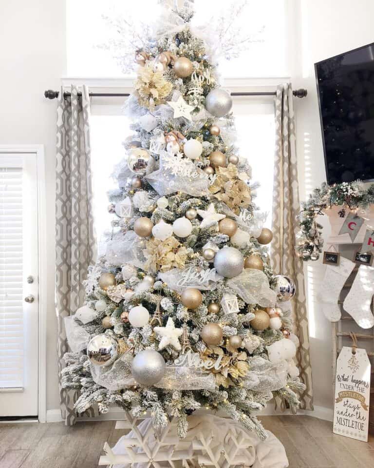 Beautiful Silver and Gold Christmas Tree Decorations with a White Tree Skirt