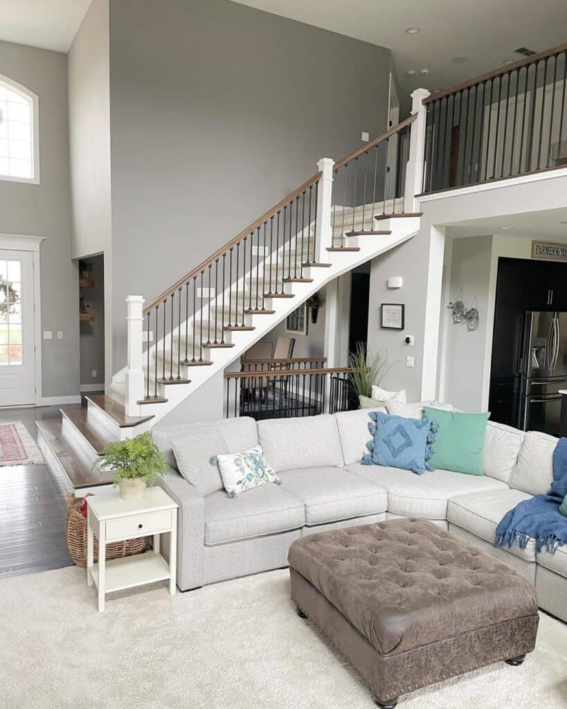 Beige Carpeted Staircase with White Stair Skirt Board