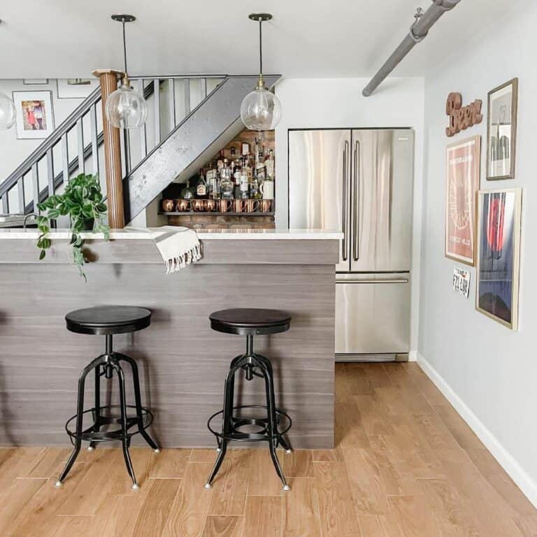 Black Bar Height Stools Under Glass Pendant Lamps