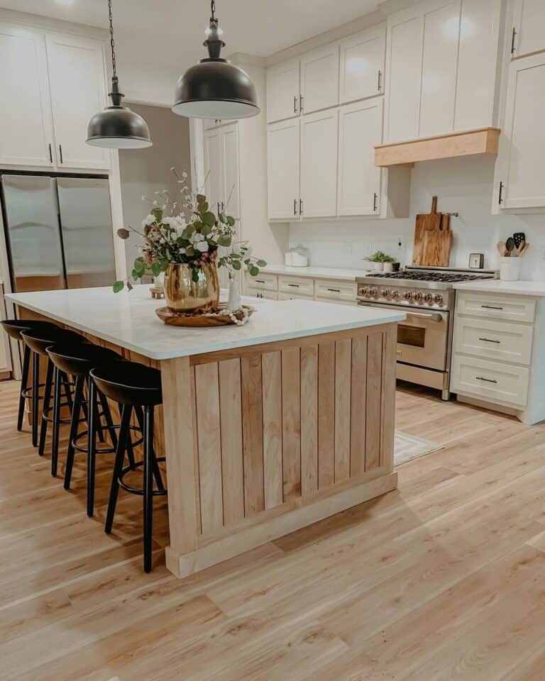 Black Bar Stools With a Back on a Light Wood Floor