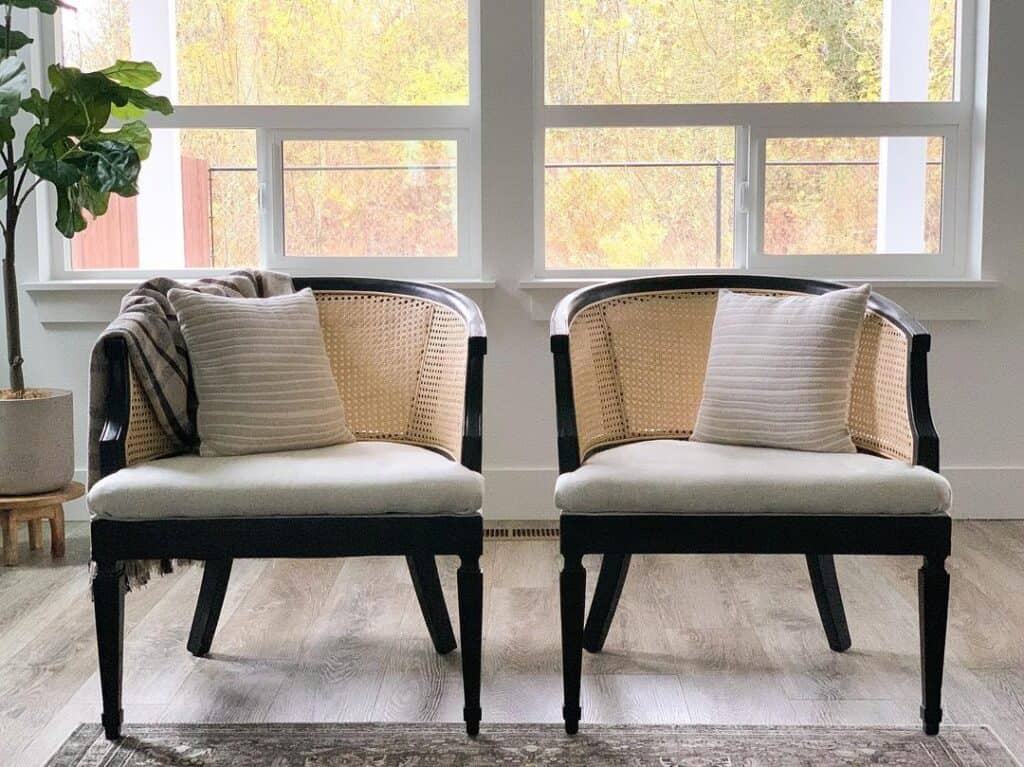 Black Barrel Cane Accent Chairs With White Cushions