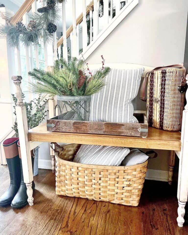 Black Boots Next to Entryway Bench With a Wicker Basket