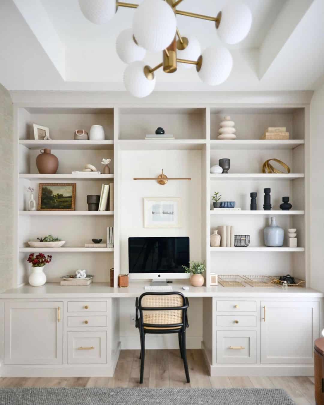 Black Cane Back Accent Chair and a White Shelving Unit Soul & Lane