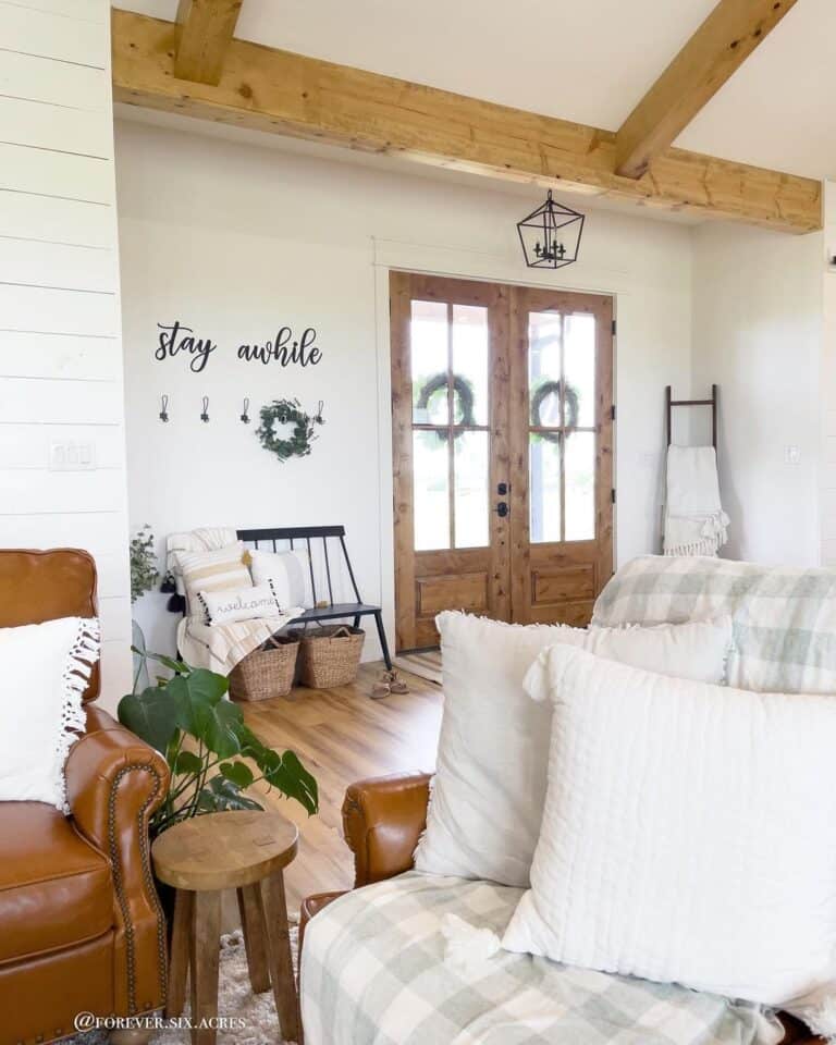 Black Entryway Bench With a Back and Wicker Baskets