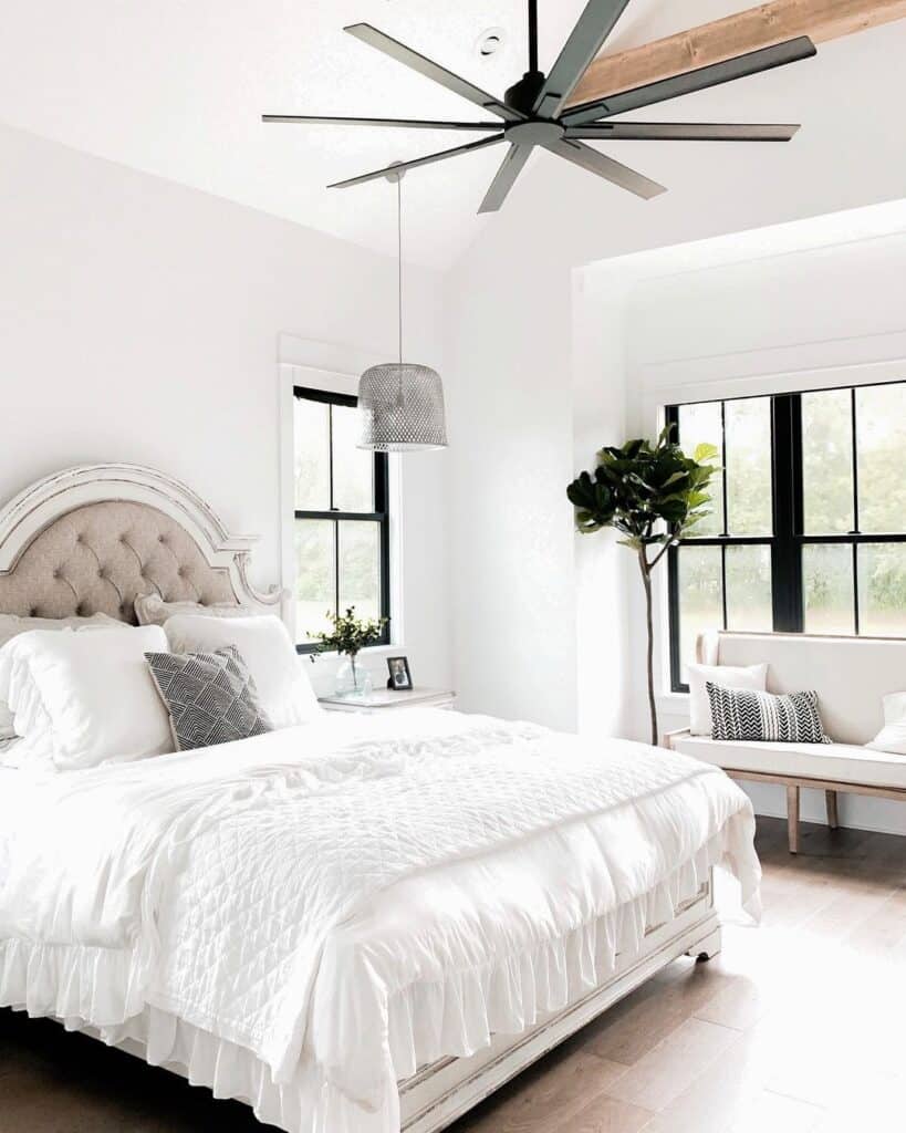 Black Fan and a Beige Tufted Headboard