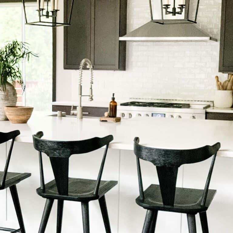 Black Lantern Light Fixture and Matte Black Bar Stools