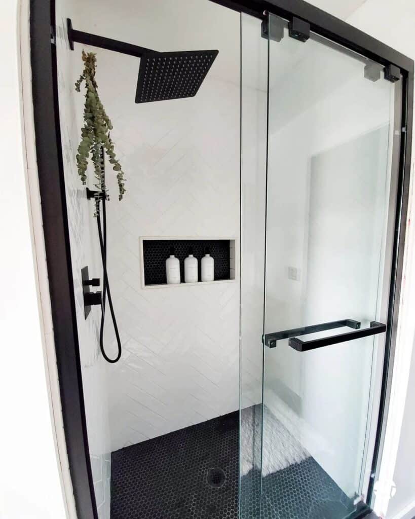 Black Penny Tile with White Shower Niche Trim
