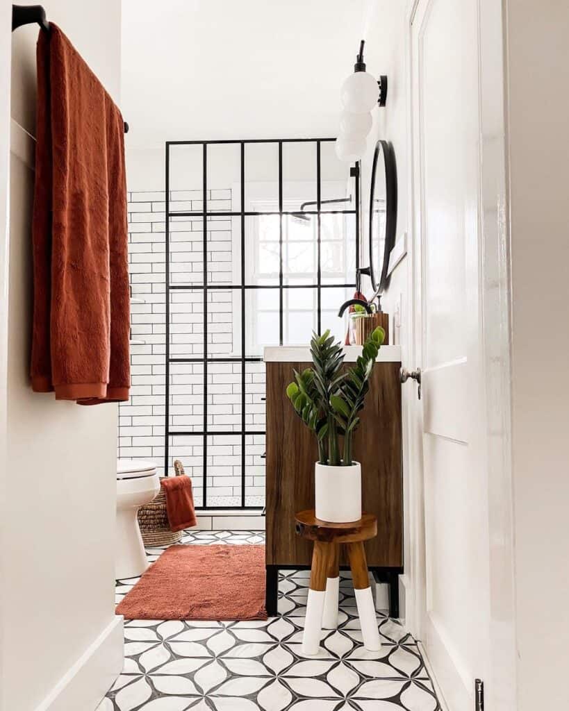 Black Shower Head Set in a White Subway Tile Shower