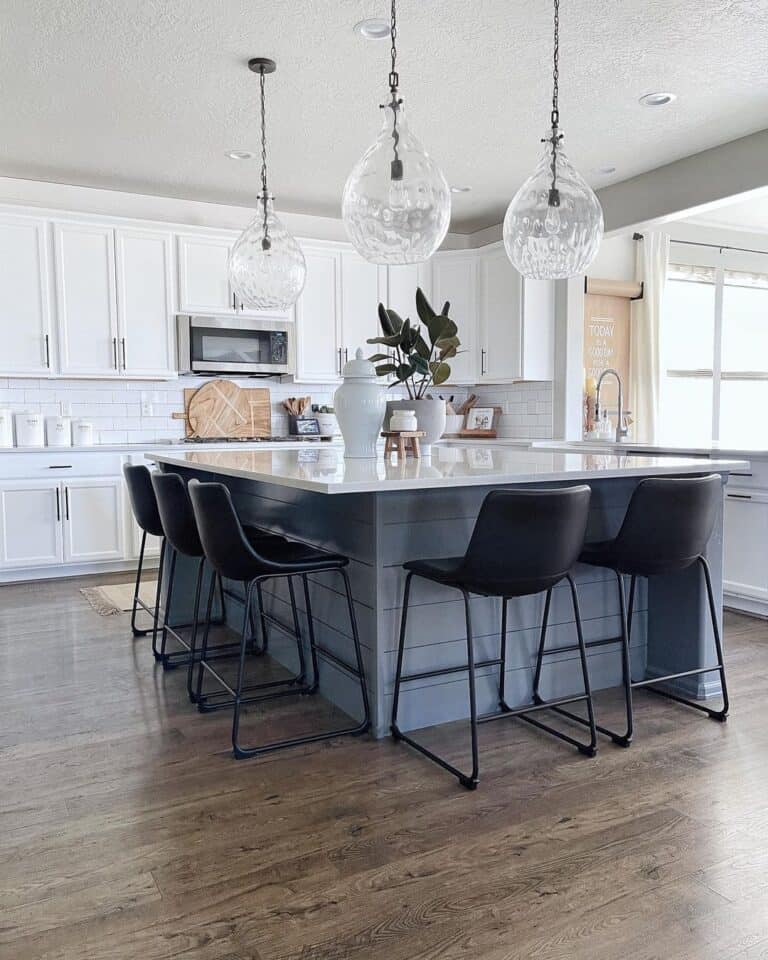 Black Stools Around Island in Open Kitchen