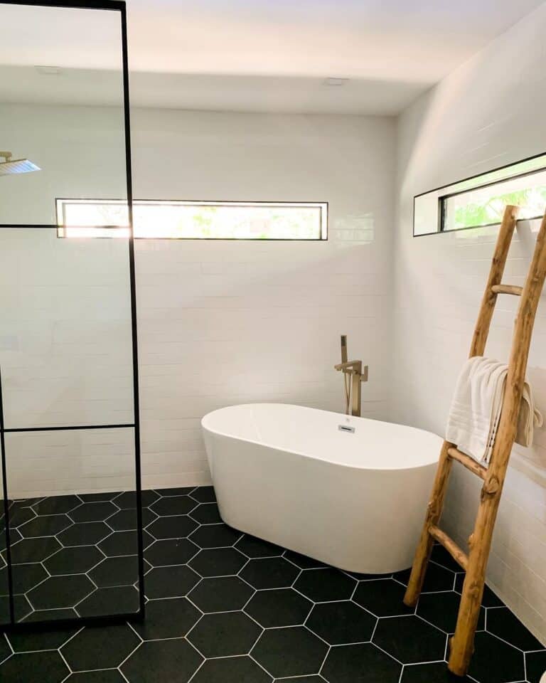 Black Tile Bathroom With Free-Standing Bathtub