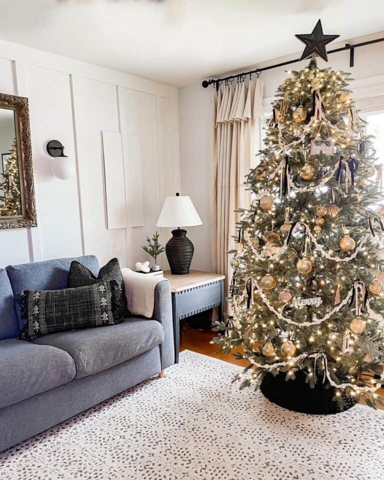 Black and Gold Christmas Tree Decorations and a Blue Couch