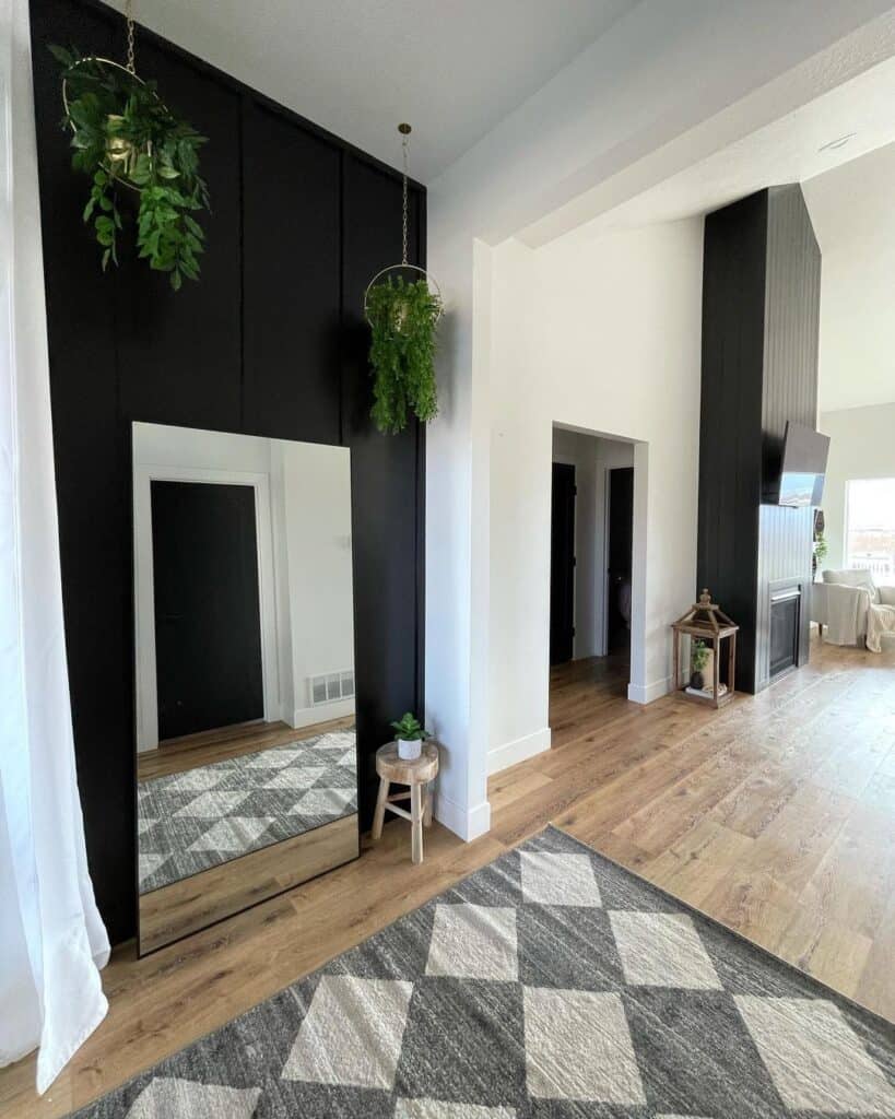 Black and White Entryway with Leaning Frameless Mirror