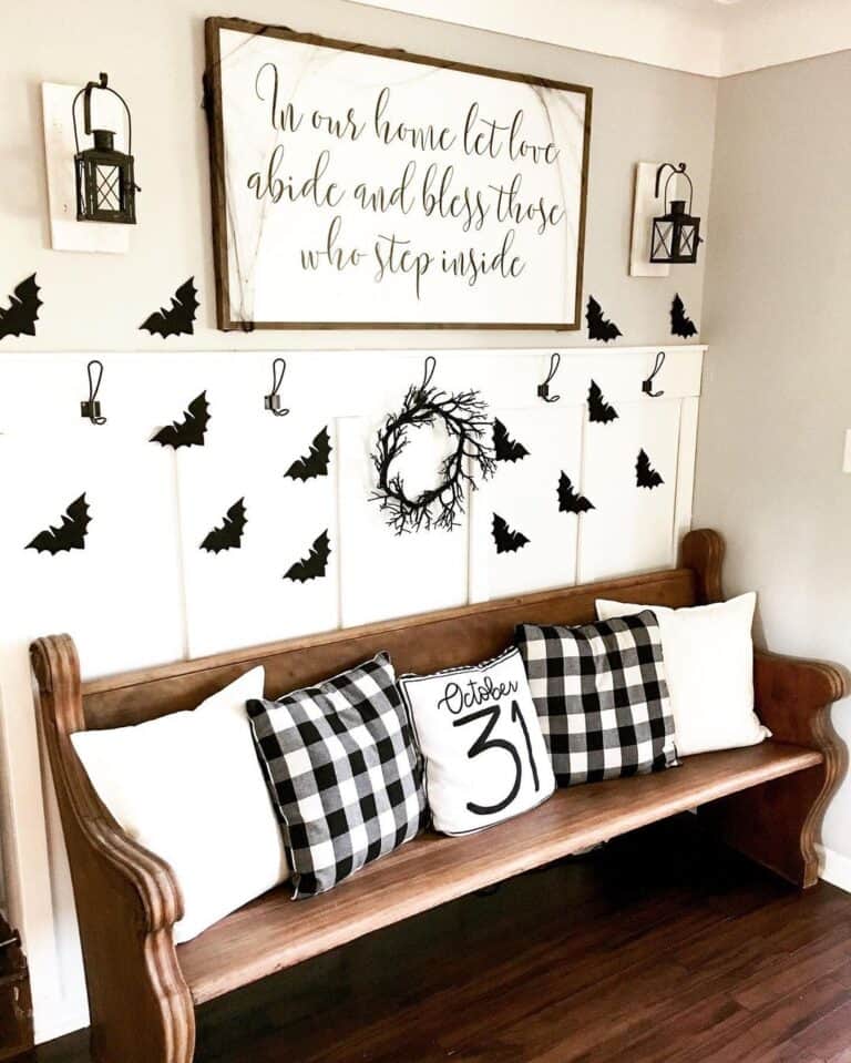 Black and White Entryway with Wooden Pew