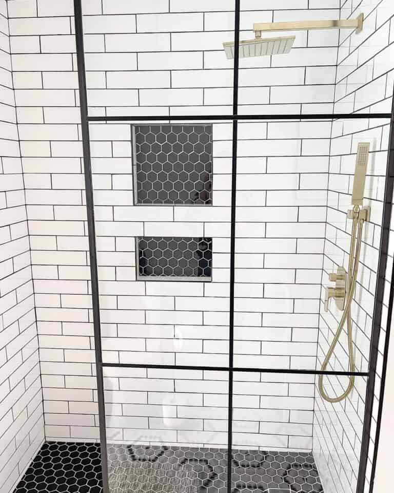 Black and White Walk-In Shower with Gold Fixtures