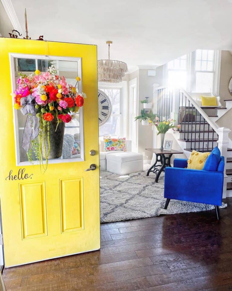 Blue Accents in Yellow Front Door Entryway