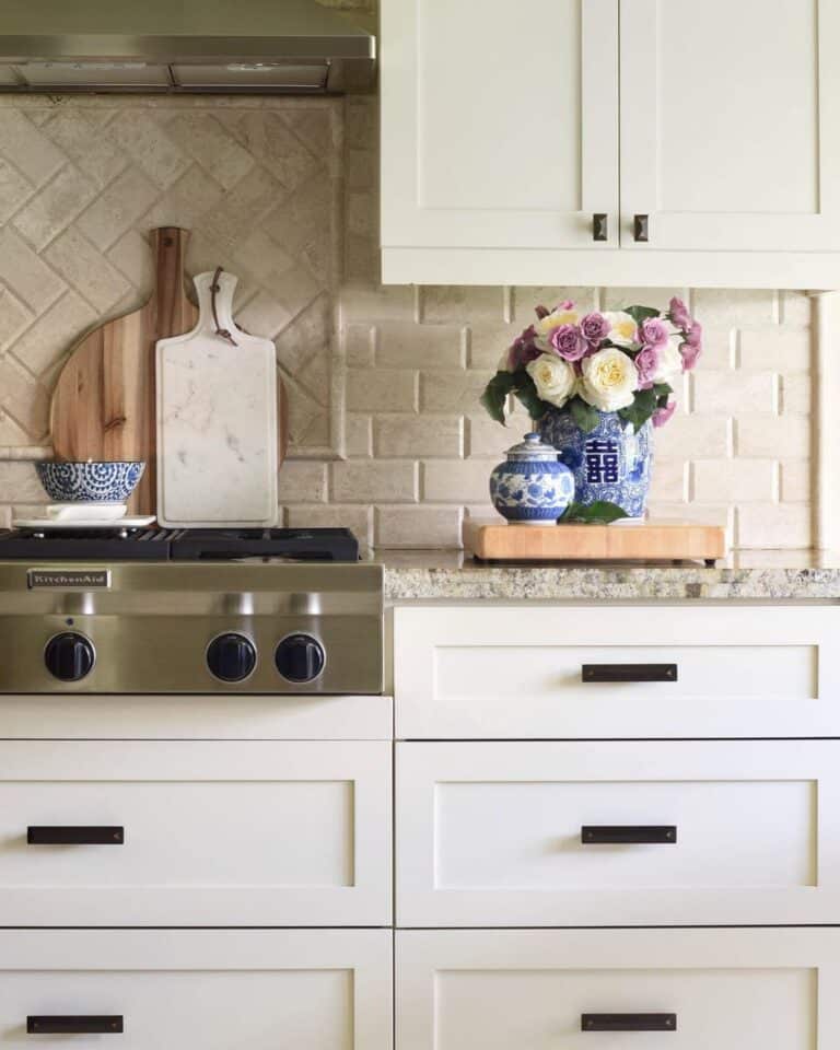 Blue Kitchen Accessories and a Beige Backsplash