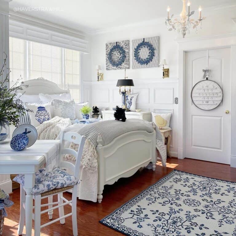 Blue and White Bedroom with Wood Flooring