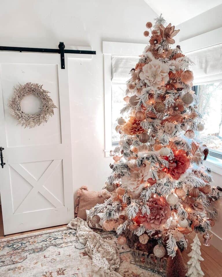 Blush Pink Christmas Tree Decorations Near a White Barn Door