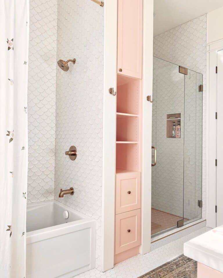 Brass Shower Head on a White Fish Scale Tile Wall