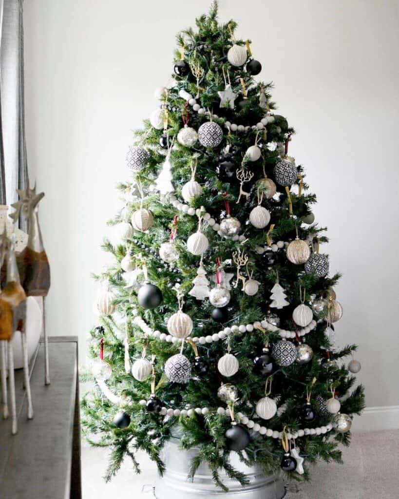 Christmas Tree with Black Christmas Ornaments and Beaded Garland