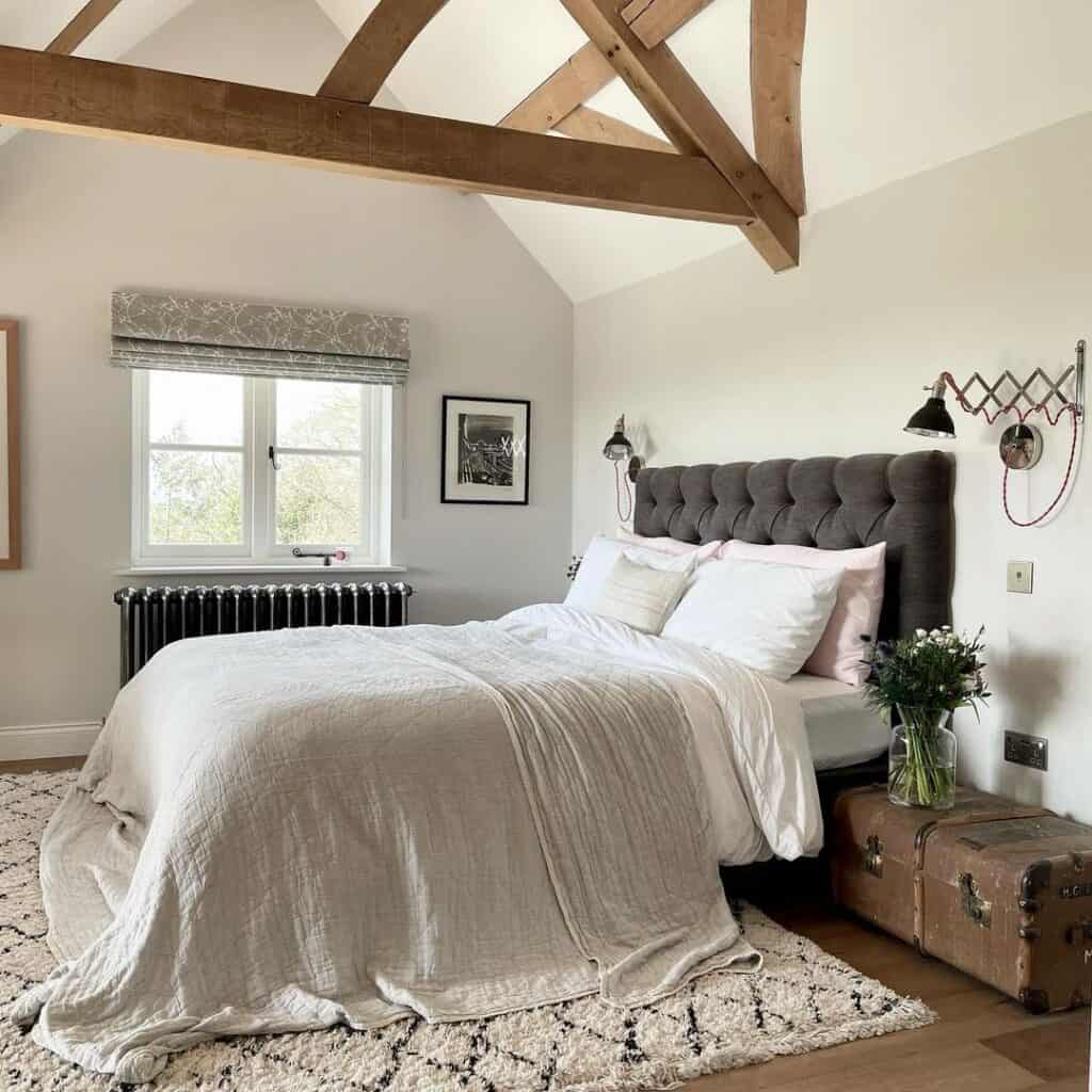 Dark Grey Velvet Tufted Headboard and a Brown Trunk