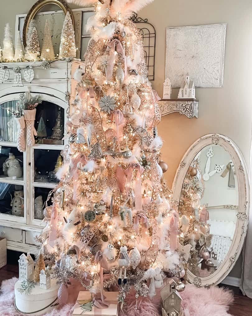 Decorated Pink Christmas Tree and a Rustic White Cabinet
