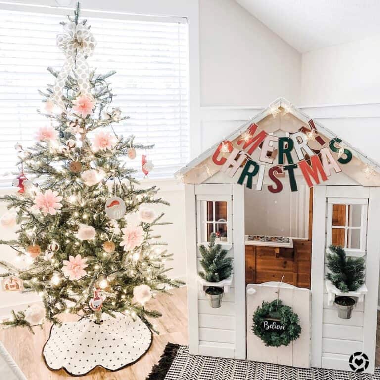 Decorated Pink Christmas Tree with a Black and White Tree Skirt